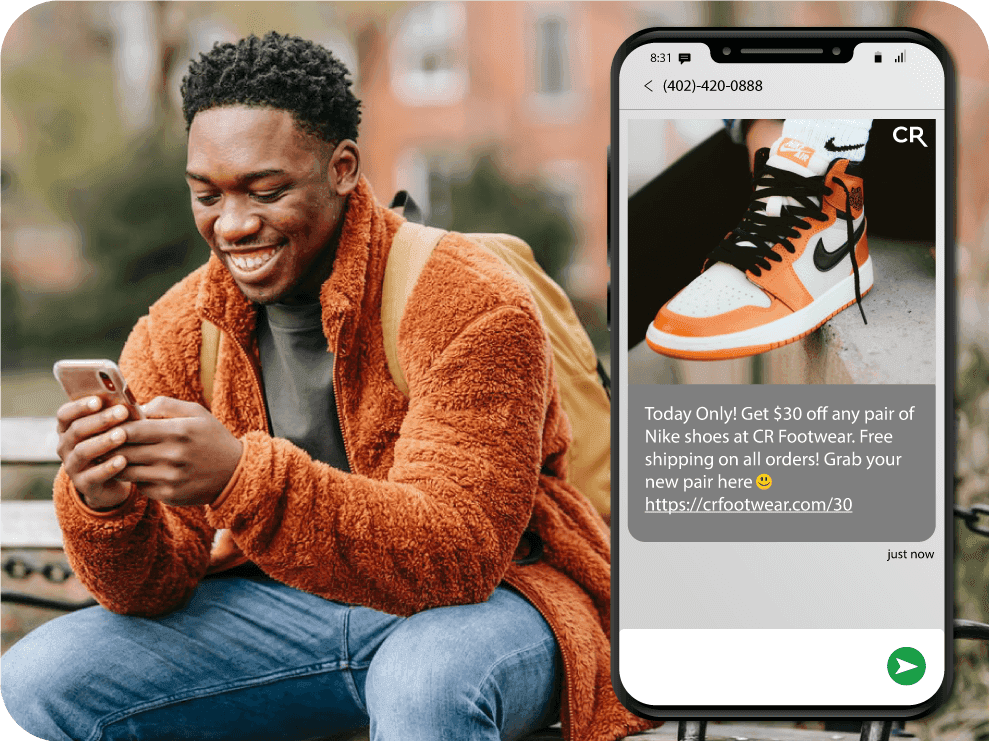 man reading an mms message sent from a business