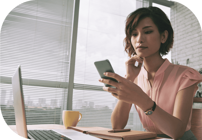 Business woman uses SMS opt in on her mobile device